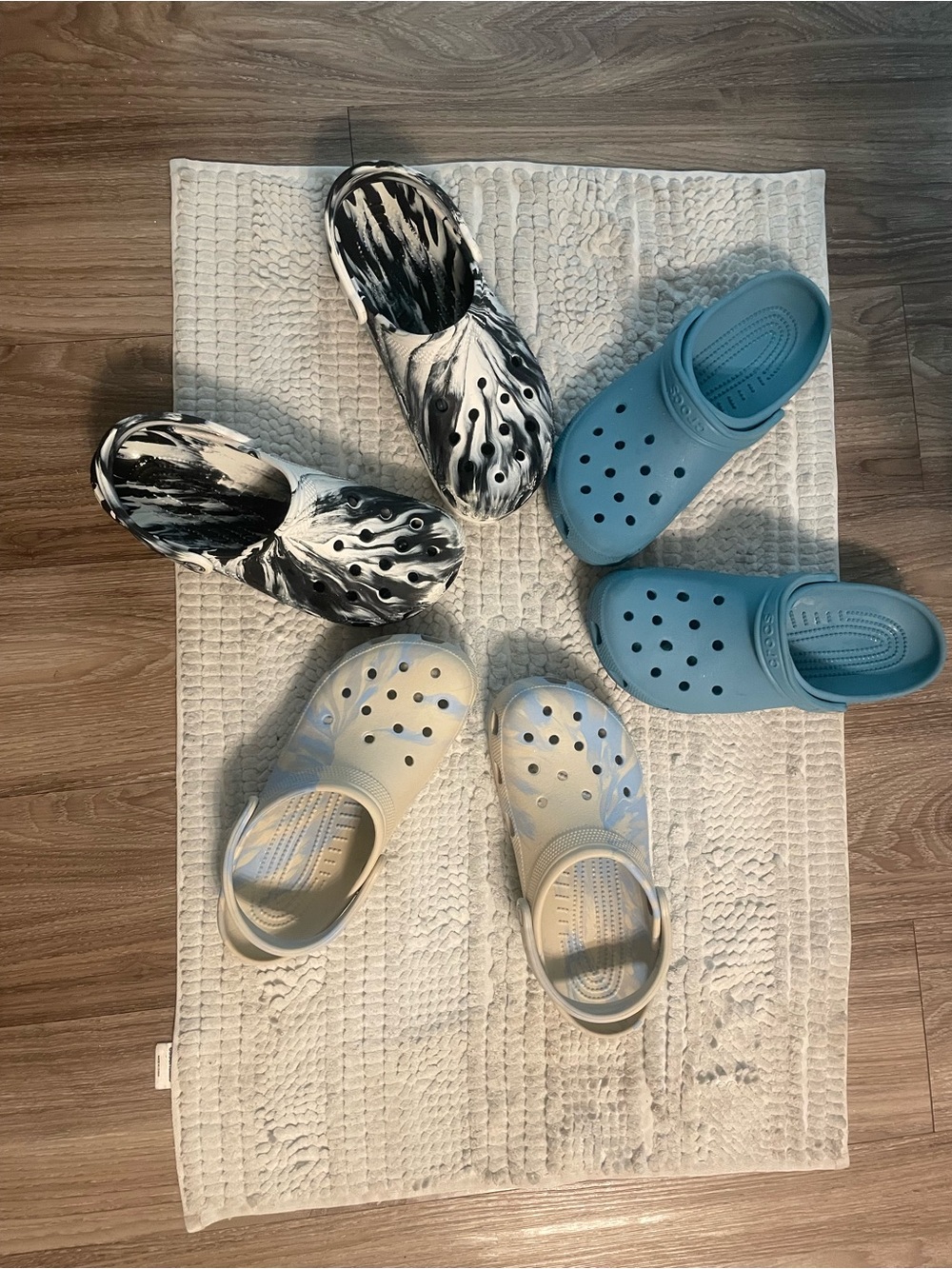 Crocs in Blue, Black/White Marble, and Cream women’s 8/mens 10